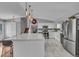 Spacious kitchen with a large center island, stainless steel appliances, and plenty of counter space at 10869 W 65Th Way, Arvada, CO 80004