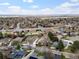 Aerial view of homes near a school and park, emphasizing a Gathering-friendly neighborhood and amenities at 10335 W 18Th Pl, Lakewood, CO 80215