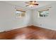 Sunny bedroom with hardwood floors and two windows providing natural light at 10335 W 18Th Pl, Lakewood, CO 80215