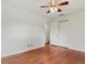 Spacious bedroom with hardwood floors, a ceiling fan, and a large closet at 10335 W 18Th Pl, Lakewood, CO 80215