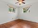 Bedroom featuring hardwood floors, with two windows providing plenty of natural light at 10335 W 18Th Pl, Lakewood, CO 80215