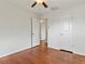 Bedroom featuring hardwood floors, multiple closets, and natural light at 10335 W 18Th Pl, Lakewood, CO 80215