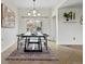 Elegant dining room featuring a modern table, stylish lighting, and easy access to outdoor patio at 10335 W 18Th Pl, Lakewood, CO 80215