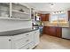 Stylish kitchen featuring granite countertops, a tile backsplash, stainless steel appliances and wood cabinets at 10335 W 18Th Pl, Lakewood, CO 80215