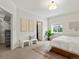 Bright main bedroom with neutral tones, plush carpet, and a cozy atmosphere at 10335 W 18Th Pl, Lakewood, CO 80215