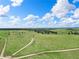 Expansive parcel of land with a long, private drive, lush pastures, and mature trees at 1752 Private Road 130, Elizabeth, CO 80107