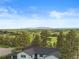 Charming home with stunning mountain views, nestled among mature trees and rolling hills at 1752 Private Road 130, Elizabeth, CO 80107