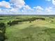 Expansive land featuring rolling green pastures, mature trees, and stunning views at 1752 Private Road 130, Elizabeth, CO 80107