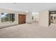 Spacious room featuring neutral carpet, large windows with beautiful views, and a double door entry at 1752 Private Road 130, Elizabeth, CO 80107
