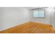 Inviting bedroom with natural light, featuring beautiful wood floors at 1180 S Monaco Pkwy # 3, Denver, CO 80224