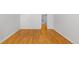 Bedroom showcasing walk-in closet and a door leading to storage space at 1180 S Monaco Pkwy # 3, Denver, CO 80224