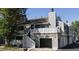 Multi-story townhome with garage, balcony and gray facade, offering a modern and stylish appearance at 1180 S Monaco Pkwy # 3, Denver, CO 80224