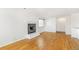 Inviting living room showcasing hardwood flooring, a fireplace, and natural light at 1180 S Monaco Pkwy # 3, Denver, CO 80224