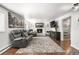 Cozy basement featuring a fireplace, modern furniture, and a large area rug at 7132 Xavier Way, Westminster, CO 80030