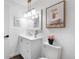A well-lit bathroom featuring modern vanity, framed artwork, and contemporary finishes at 7132 Xavier Way, Westminster, CO 80030