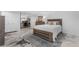 Spacious bedroom boasts an epoxy floor, dedicated desk area, and contemporary furnishings at 7132 Xavier Way, Westminster, CO 80030