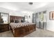 Comfortable bedroom featuring a statement headboard, soft carpet, and bright natural light at 7132 Xavier Way, Westminster, CO 80030