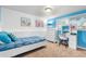 Bedroom with blue accent wall, white furniture, and natural light at 7132 Xavier Way, Westminster, CO 80030