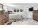 A stylish bedroom featuring a unique epoxy floor, modern furniture, and sleek decor at 7132 Xavier Way, Westminster, CO 80030