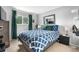 Cozy bedroom with large window, plush carpet, and stylish blue comforter at 7132 Xavier Way, Westminster, CO 80030