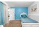 Bedroom featuring blue accent wall, hardwood floors, and natural light at 7132 Xavier Way, Westminster, CO 80030