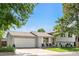 Beautifully maintained two-story home with a spacious front yard, a wide driveway, and a two-car garage at 7132 Xavier Way, Westminster, CO 80030