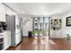 Bright kitchen with stainless steel appliances, hardwood floors, and sliding doors leading to the backyard at 7132 Xavier Way, Westminster, CO 80030