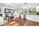 Bright kitchen featuring hardwood floors, stainless steel appliances, and granite countertops at 7132 Xavier Way, Westminster, CO 80030