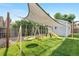 Backyard playground featuring swings, a slide, and a sunshade at 7132 Xavier Way, Westminster, CO 80030