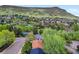 Scenic view of houses nestled among lush trees, set against a backdrop of mountains at 207 Iowa Dr, Golden, CO 80403