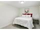 Well-lit bedroom with white bedding and a side table with metal accents at 207 Iowa Dr, Golden, CO 80403