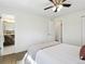 Bright bedroom features ceiling fan, hardwood floors, and an en suite bathroom at 207 Iowa Dr, Golden, CO 80403
