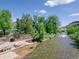 Scenic view of Clear Creek flowing past a park, perfect for nature lovers and families at 207 Iowa Dr, Golden, CO 80403