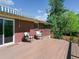 Inviting wooden deck featuring outdoor seating and a charming awning at 207 Iowa Dr, Golden, CO 80403