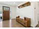 Inviting foyer with hardwood floors, decorative bench, and a view of the front door at 207 Iowa Dr, Golden, CO 80403
