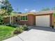 Charming single-story brick home with an attached garage and well-maintained front yard at 207 Iowa Dr, Golden, CO 80403