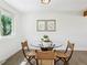 Bright kitchen eating nook with a round glass table and artistic decorations at 207 Iowa Dr, Golden, CO 80403