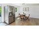 Bright eat-in kitchen with stainless steel refrigerator and modern decor at 207 Iowa Dr, Golden, CO 80403