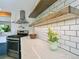 Modern kitchen features stainless steel appliances, quartz counters and bright white subway tile backsplash at 207 Iowa Dr, Golden, CO 80403
