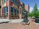 Bronze statue with outdoor seating and dining at Bridgewater Grill in historic downtown at 207 Iowa Dr, Golden, CO 80403