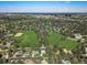 Aerial view showcasing the city, green spaces, and homes, highlighting the neighborhood's prime location and community amenities at 3026 S Alton Ct, Denver, CO 80231