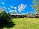 Spacious backyard features a well-maintained lawn and a home with a patio area at 3026 S Alton Ct, Denver, CO 80231