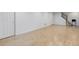 Finished basement with light wood flooring and access to the upper floor via a staircase at 3026 S Alton Ct, Denver, CO 80231