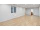 Spacious finished basement with light wood floors and recessed lighting at 3026 S Alton Ct, Denver, CO 80231