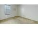 Bedroom with neutral carpet, white walls, and natural light from a window at 3026 S Alton Ct, Denver, CO 80231