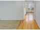 Inviting hallway featuring hardwood floors leading to a bright, open space at 3026 S Alton Ct, Denver, CO 80231