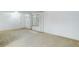 Bright living room with large window and carpeted floor at 3026 S Alton Ct, Denver, CO 80231
