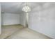 Carpeted living room with white walls at 3026 S Alton Ct, Denver, CO 80231