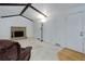 Cozy living room featuring a brick fireplace and vaulted ceiling at 3026 S Alton Ct, Denver, CO 80231