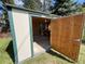 Inside the storage shed, insulation, natural light and shelving make for a great space for storing items at 3026 S Alton Ct, Denver, CO 80231